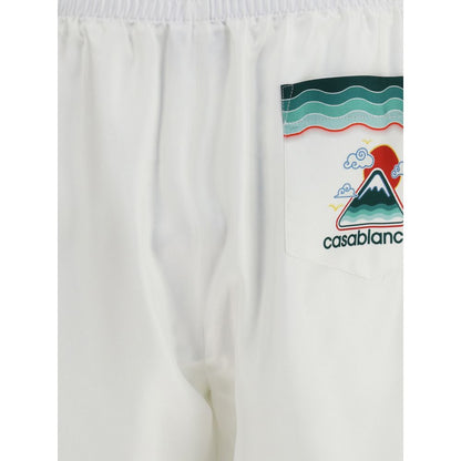 Close-up of Casablanca White Silk Bermuda Shorts with Japanese iconography print on pocket, showcasing elastic waistband and silk twill material.