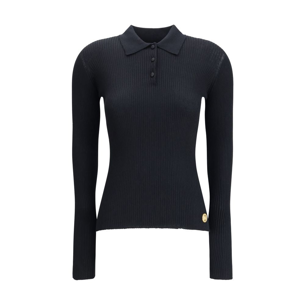 Dolce & Gabbana Black Cashmere Polo Shirt with ribbed design, classic collar, and three-button closure, ideal for casual or sophisticated looks.