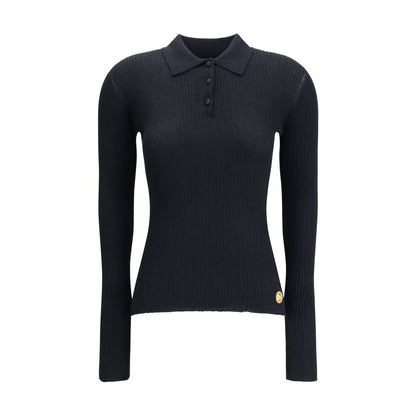 Dolce & Gabbana Black Cashmere Polo Shirt with ribbed design, classic collar, and three-button closure, ideal for casual or sophisticated looks.
