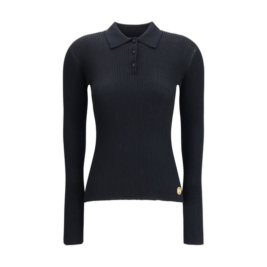 Dolce & Gabbana Black Cashmere Polo Shirt with ribbed design, classic collar, and three-button closure, perfect for elegant outfits.