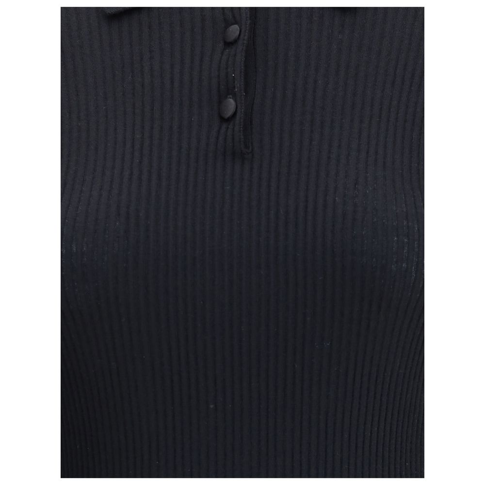 Dolce & Gabbana Black Cashmere Polo Shirt with ribbed design and three-button closure, ideal for both casual and sophisticated looks.