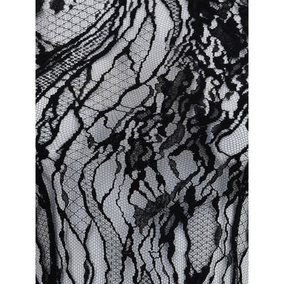 Close-up view of sheer lace on Balmain Black Cotton Top with intricate pattern, a sophisticated garment for bold, feminine looks.