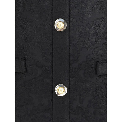 Close-up of Balmain Black Viscose Cocktail Dress with gold buttons and baroque pattern.