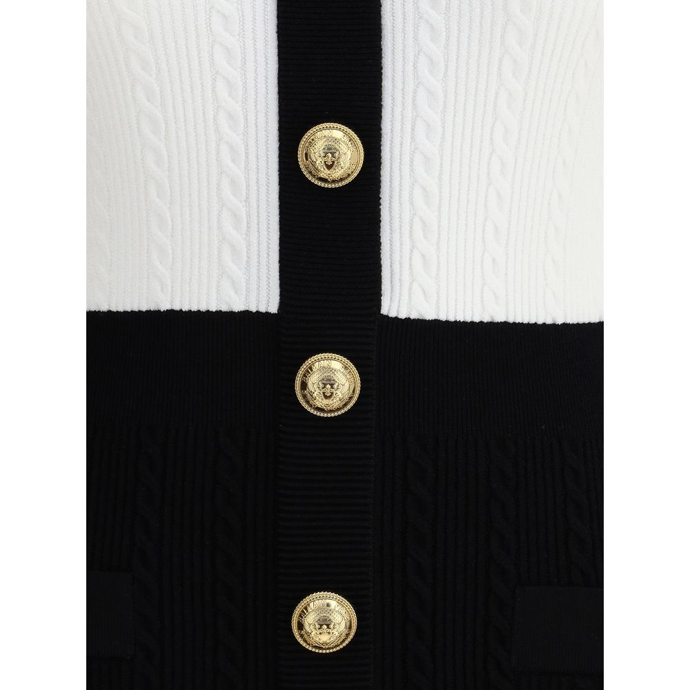 Close-up of embossed buttons on Balmain Multicolor Viscose Casual Dress with braided pattern and V-neckline.