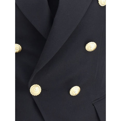 Close-up of Balmain Black Wool Blazer with embossed buttons and wide lapels, showcasing elegant design and craftsmanship.
