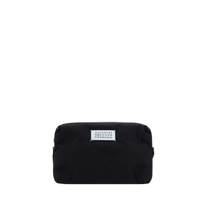 Margiela Black Nylon Shoulder Bag with contrasting logo label, zipper closure, and adjustable strap. AW25 season accessory.