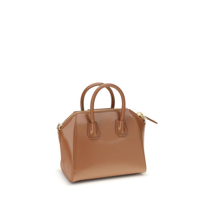 Givenchy Brown Calf Leather Bos Taurus Handbag with geometric design, top handles, and adjustable strap for versatile style.