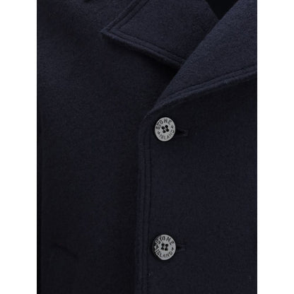 Close-up of Stone Island Blue Fleece Wool Coat with snap-button closure featuring Stone Island logo buttons.