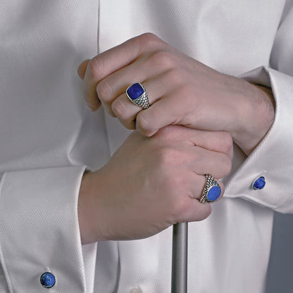 ALBERT M. JEWELS JEWELRY Mod. WSOX00174.TRQ elegant men's rings with blue stones on hands.