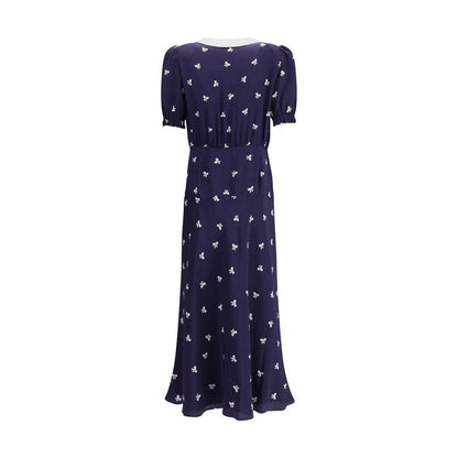 Back view of Alessandra Rich Blue Silk Casual Dress with bow pattern and puff sleeves for a vintage-inspired look.