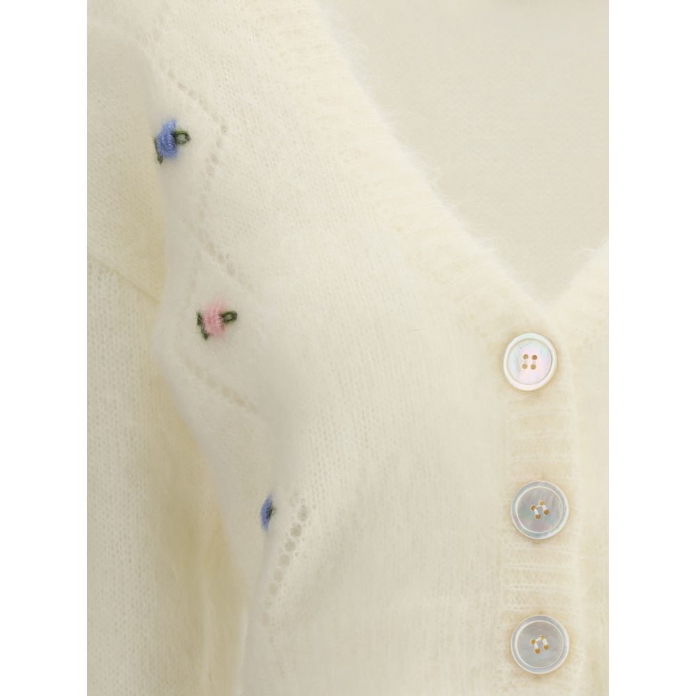 Close-up of Alessandra Rich White Mohair Cardigan with floral embroidery, button closure, and ribbed hem detail.