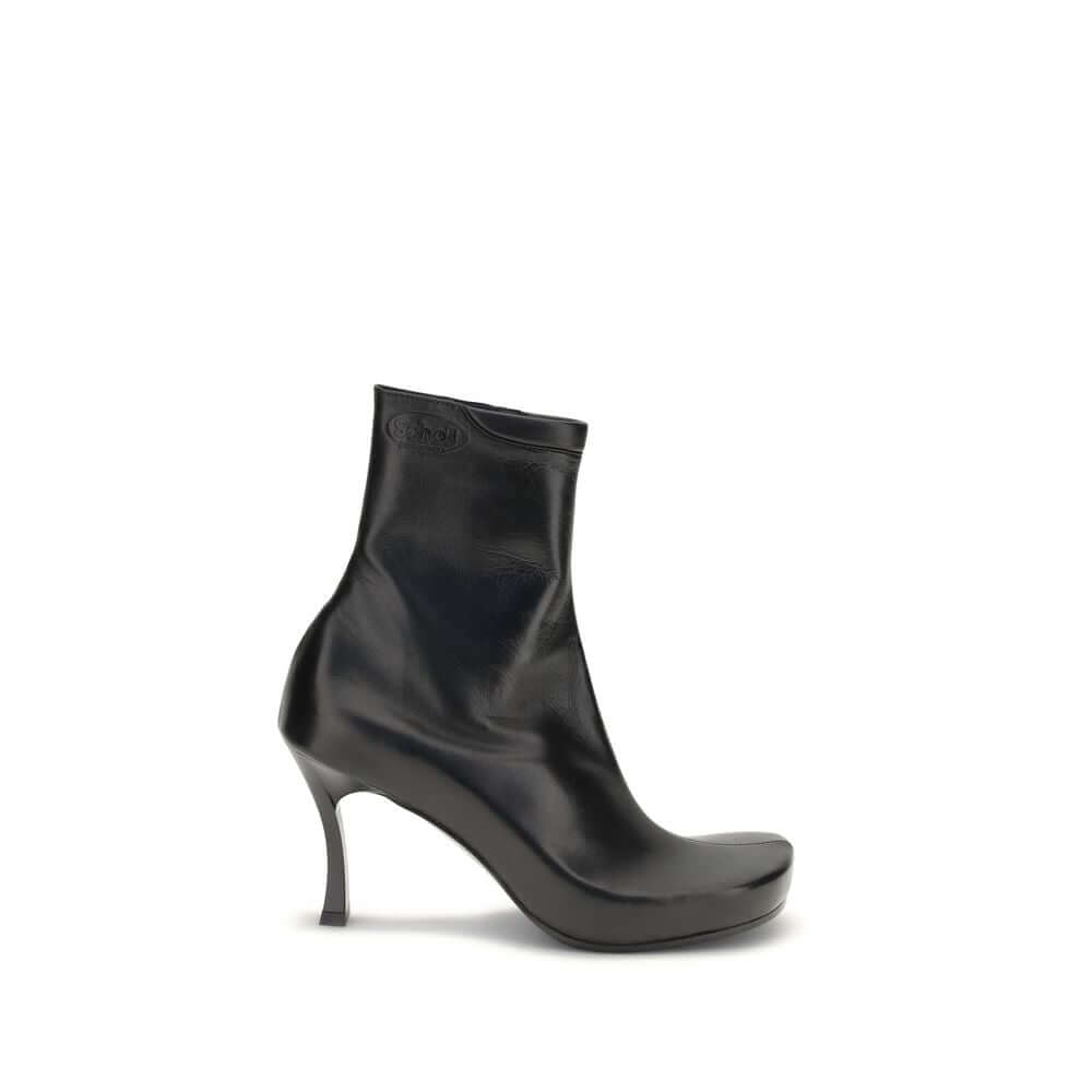 Balenciaga Black Calf Leather Bos Taurus Ankle Boots with square toe and ergonomic insole, featuring embossed logos from collaboration.