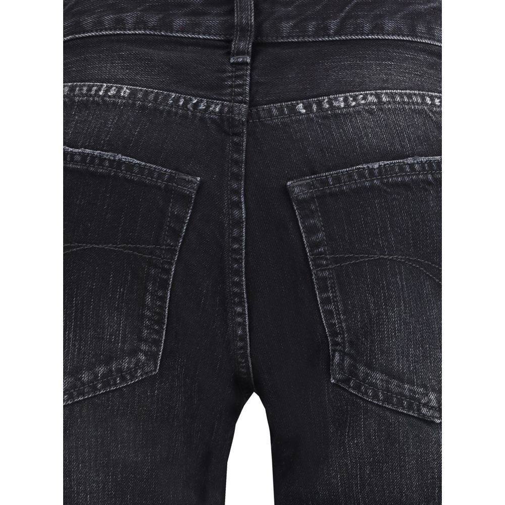 Close-up of Balenciaga Black Cotton Relaxed Fit Jeans showing faded denim and pocket details.