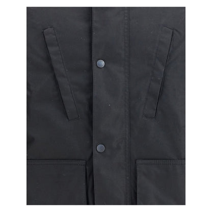 Close-up of Barbour International Black Cotton Parka showing front buttons and pocket details.