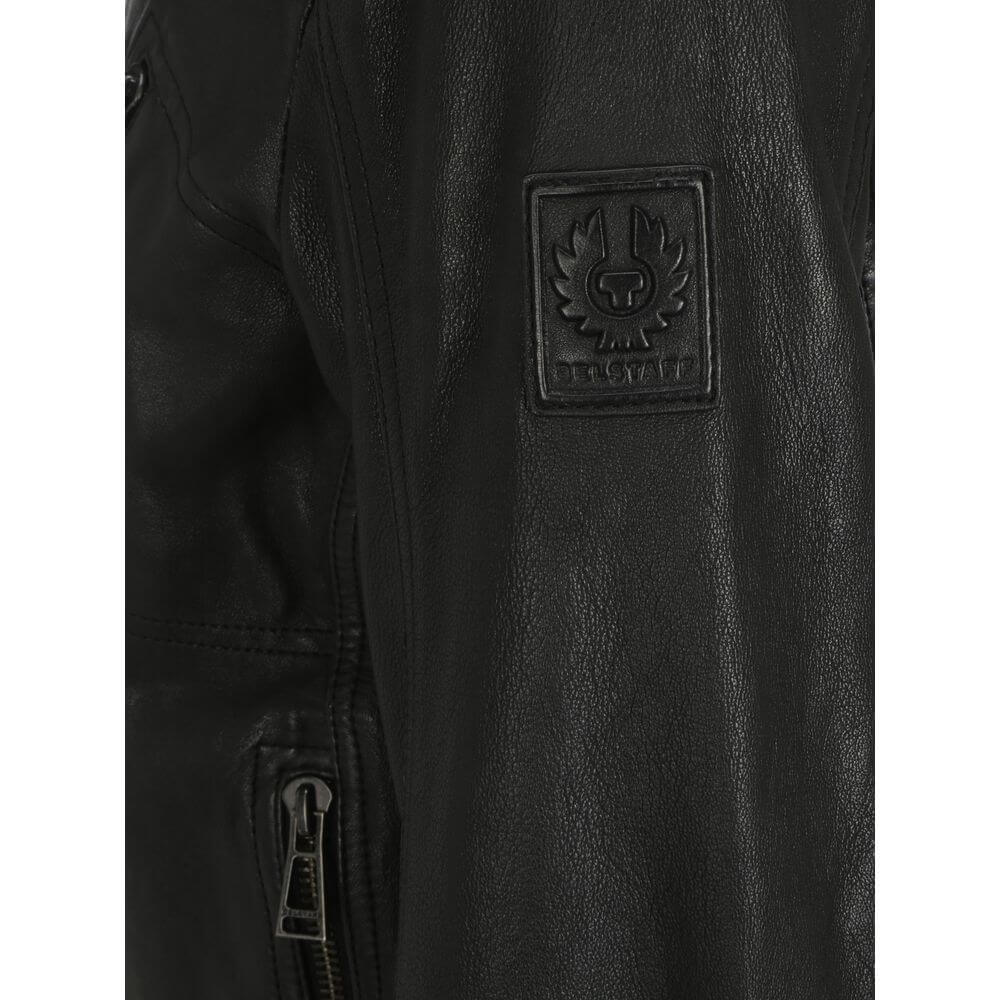 Detail of Belstaff Black Leather Jacket with embossed logo patch on sleeve and sleeve zipper.