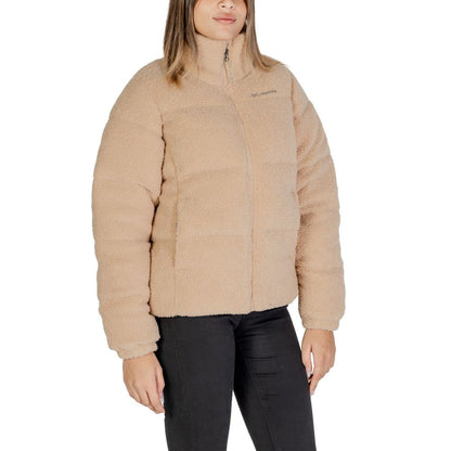 Woman wearing Columbia Beige Nylon Coat with soft Sherpa lining, perfect for cold weather and versatile for city or mountain adventures.