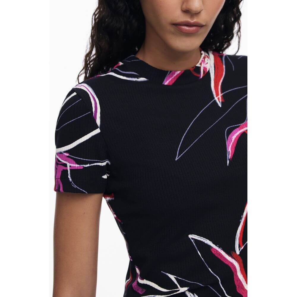 Model wearing Desigual Black Viscose Women Top with signature print and short sleeves.