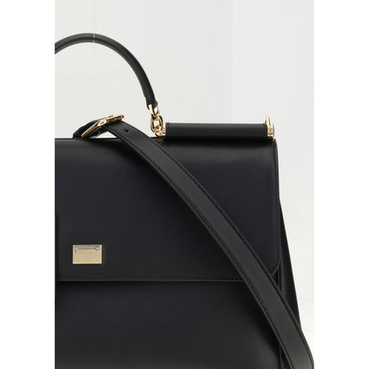 Dolce & Gabbana Black Calf Leather Bos Taurus Shoulder Bag with adjustable strap and brass detailing.