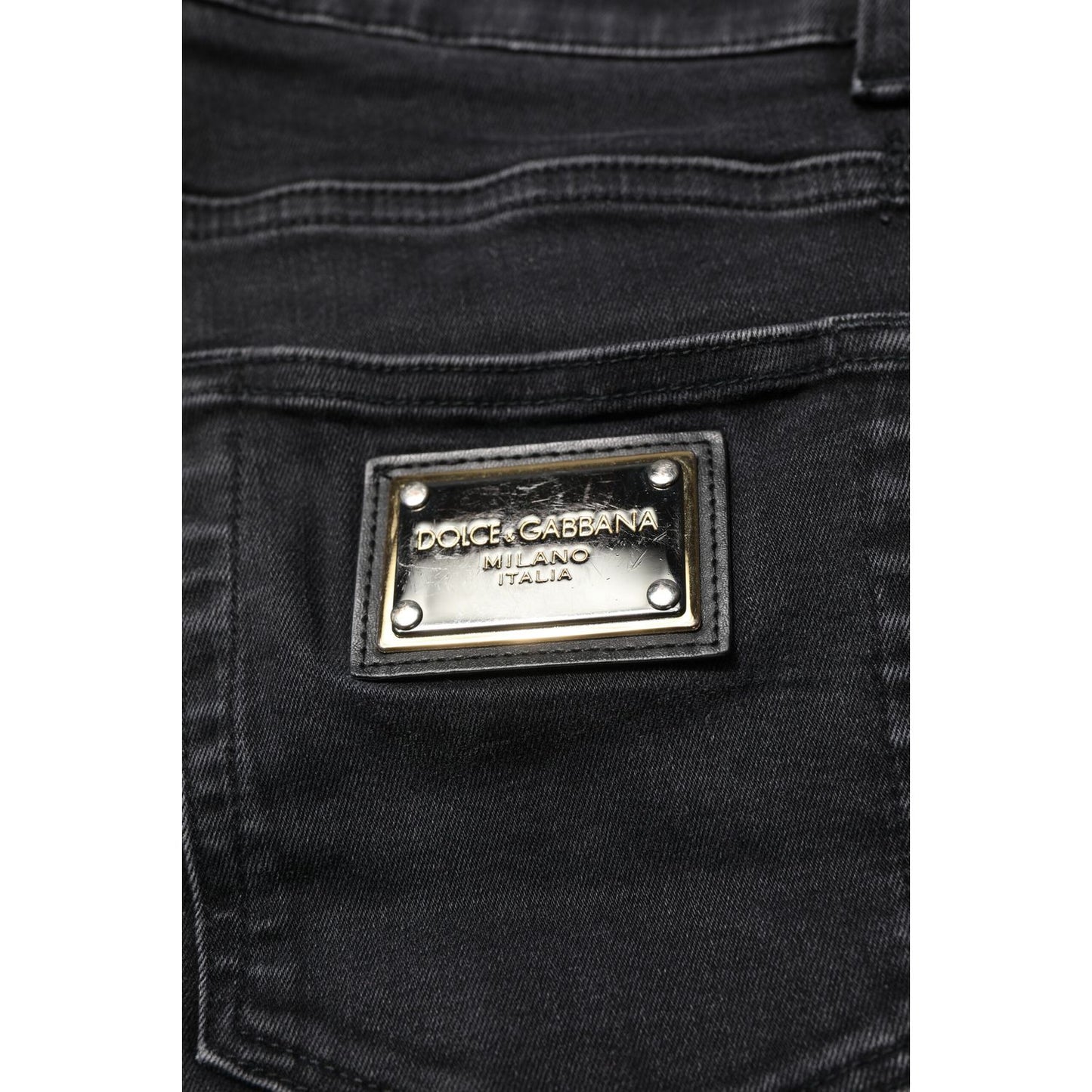 Close-up of Dolce & Gabbana Black Cotton Skinny Men Denim Jeans with logo detail and high craftsmanship.