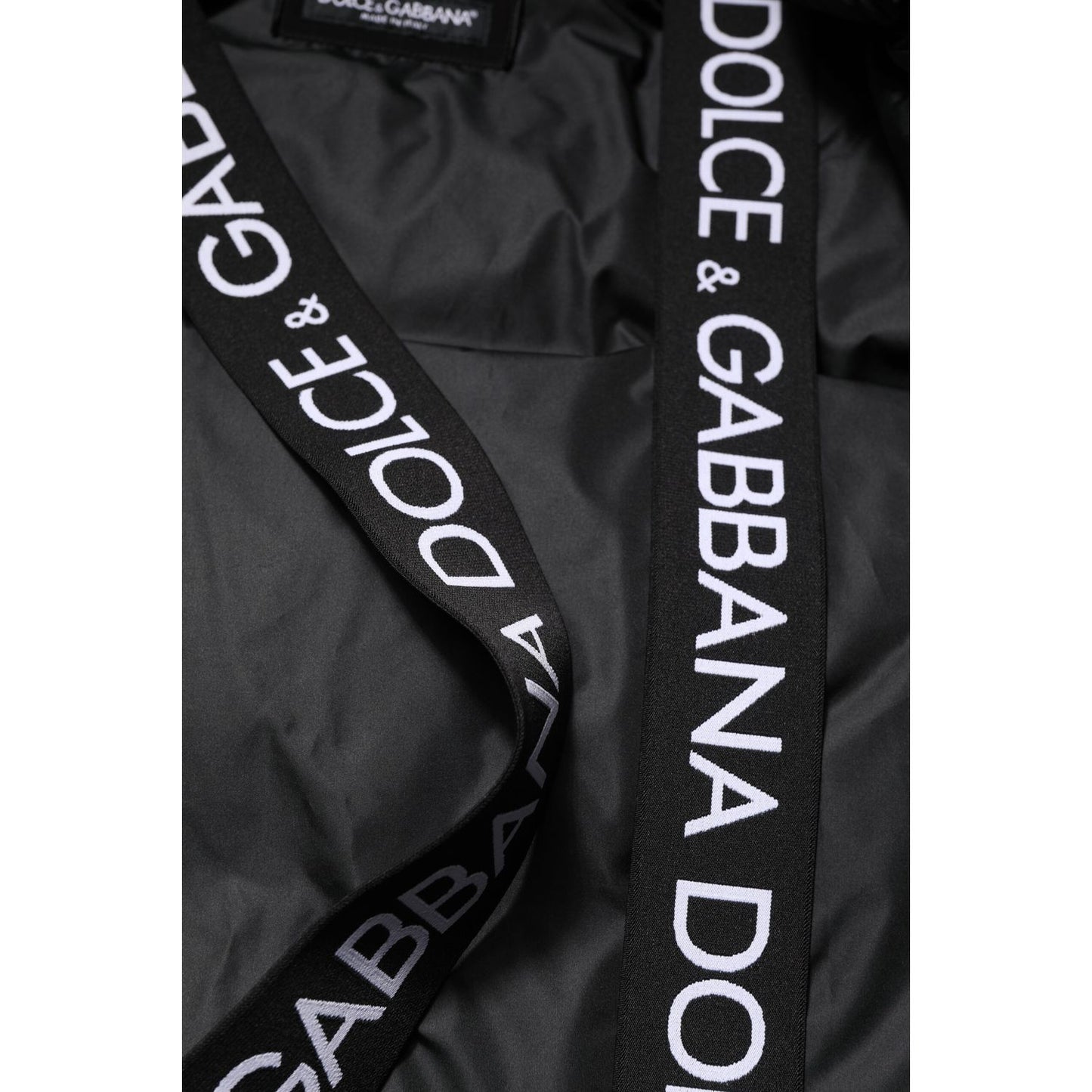 Close-up of Dolce & Gabbana Black Logo Full Zip Hooded Quilted Jacket showing logo details on black nylon material.