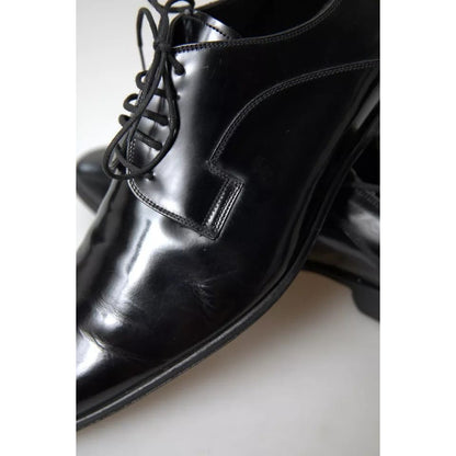 Dolce & Gabbana Black Polished Leather Formal Dress Shoes with minor wear signs, logo details, and high craftsmanship.