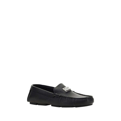 Dolce & Gabbana Black Rubber Slip-On Loafers with calfskin and metal monogram plaque, flat sole non-slip design, AW25 collection.