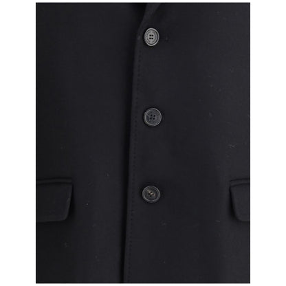 Close-up of Dsquared² Black Wool Coat buttons and pockets, showcasing felted wool texture and elegant design.