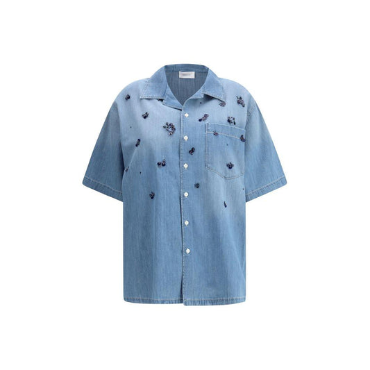 Fabiana Filippi Short sleeve denim ShirtFabiana Filippi’s Denim Shirt combines the casual spirit of denim with precious and feminine details. Featuring a classic collar, short sleeves and a patch pocket on the front, it has a button closure and refined se