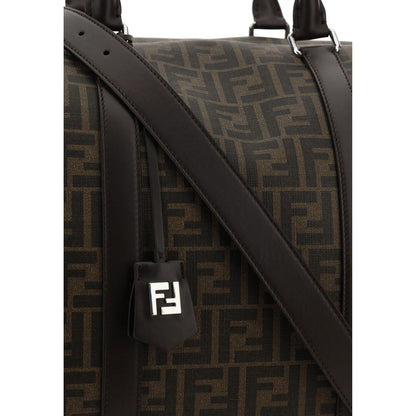 Close-up of Fendi Brown Canvas Luggage And Travel bag with FF monogram design and leather strap.