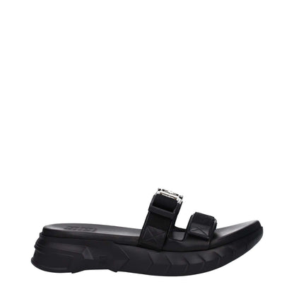 Givenchy Black Fabric Slippers with silver logo, clips closure, rubber sole, mid heels, open toe design, and heel height of 4 cm.