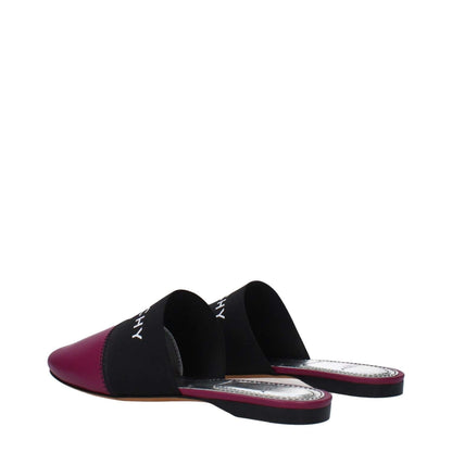 Givenchy Purple Leather Slippers with round toe and front logo, made from leather in dark orchid, featuring low flat heel.