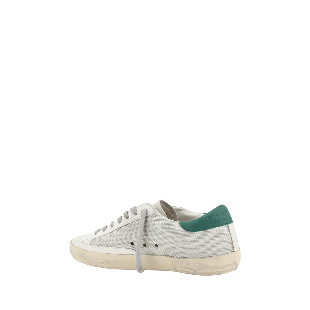 Side view of Golden Goose White Calf Leather Bos Taurus Low Top Sneakers with green heel detail and vintage effect design.
