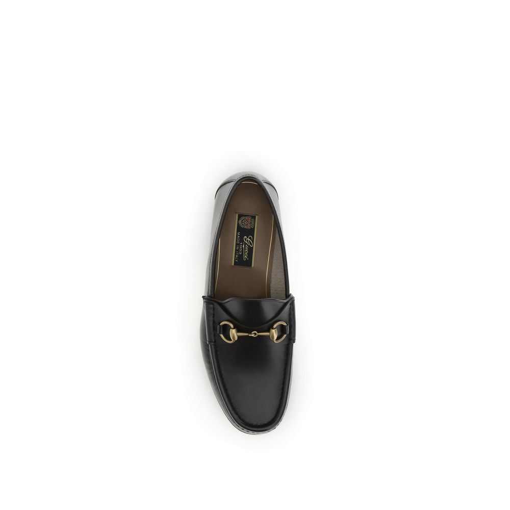 Top view of Gucci Brown Calf Leather Bos Taurus Slip-On Loafers with gold Horsebit detail, part of the 1953 Collection.