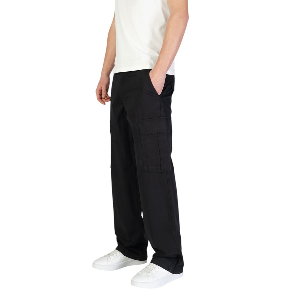Model wearing Jack Jones Black Cotton Cargo Pants with side flap pockets, showcasing comfort and style in a casual outfit.