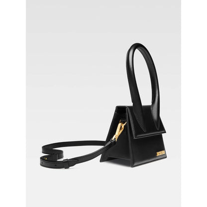 Jacquemus Le Chiquito Moyen Black Bag with gold hardware, reinforced handle, removable strap, and magnetic flap closure.