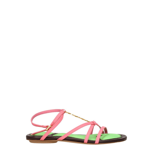 Jacquemus Pink Leather Flat Sandals with a buckle closure, open toe, and gold logo, featuring a low flat heel and leather sole.