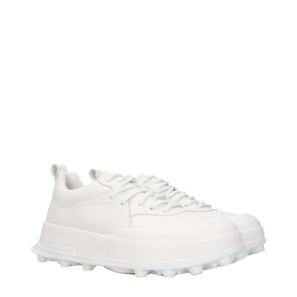 Jil Sander White Leather Sneakers with round toe and mid heels, featuring lace-up closure and rubber sole for a sporty glam style.