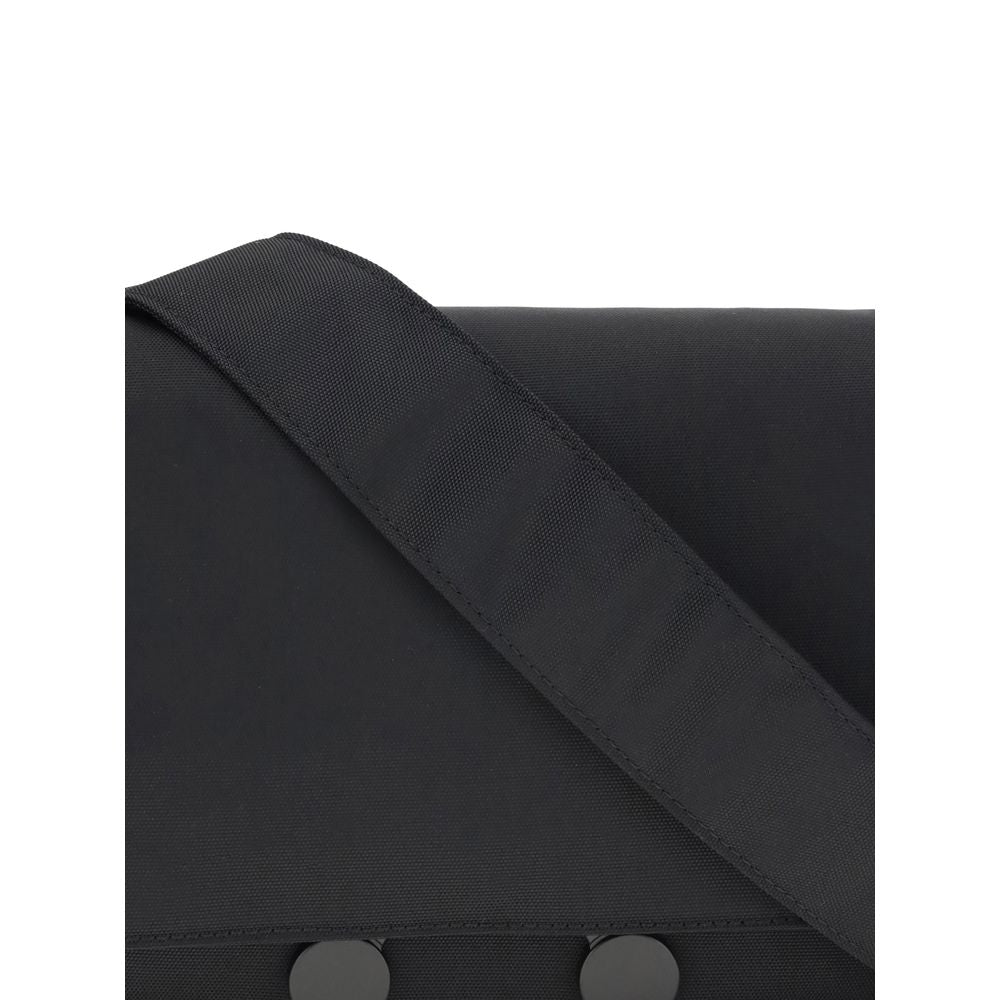 Marni Black Polyamide Clutch Bag with strap detail, showcasing durable waterproof material and modern urban design.