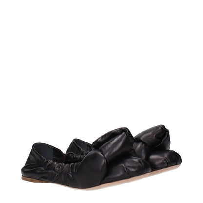 Miu Miu Black Leather Ballet Flats with round toe and low flat heel, featuring a detailed front design. Casual style footwear for everyday wear.
