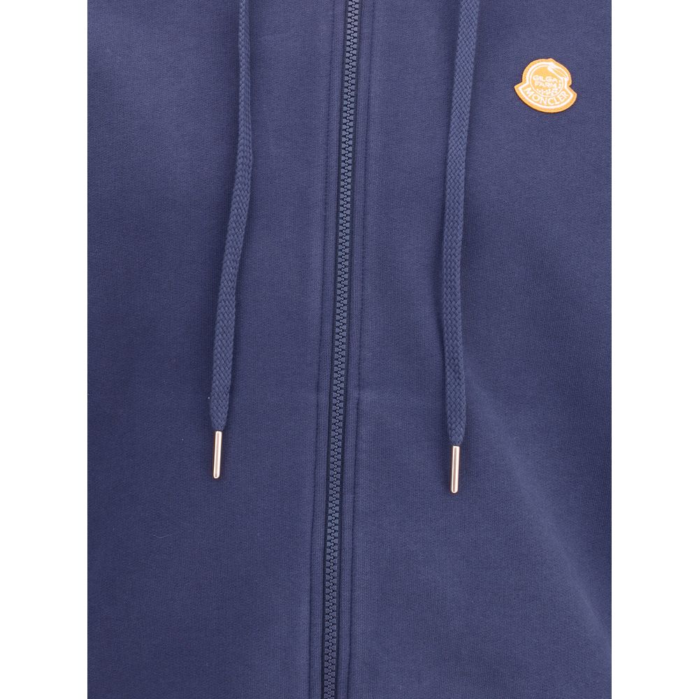 Moncler x Donald Glover Blue Cotton Sweatshirt with gold logo and drawstring on zipper front, showcasing soft cotton fleece detail.