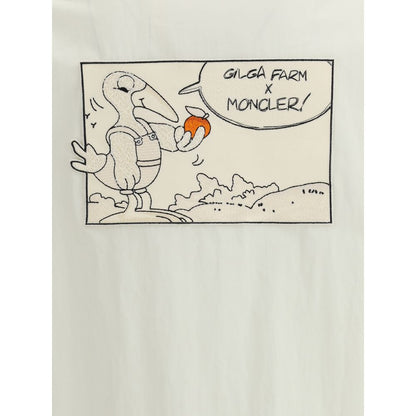 Moncler x Donald Glover White Cotton Coat featuring comic-style patch with Moncler mascot visiting Gilga Farm, artistic and functional design.