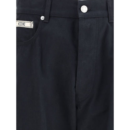 Moschino Black Cotton Casual Pants with signature patch, featuring five-pocket design, zip-and-button closure, and waist loops.