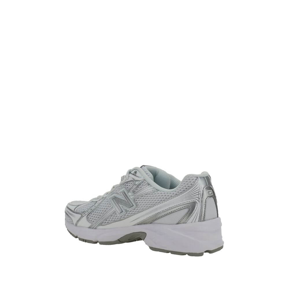 Back view of New Balance White Polyurethane Athletic Sneakers with mesh details and reinforced rubber sole.