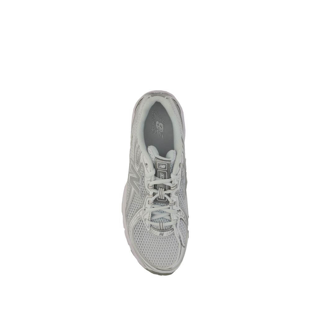 Top view of New Balance White Polyurethane Athletic Sneakers with mesh details and iconic logo on tongue.