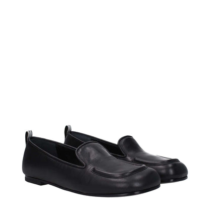 Premiata Black Leather Slip-On Loafers with round toe, flat leather sole, and back logo detail.
