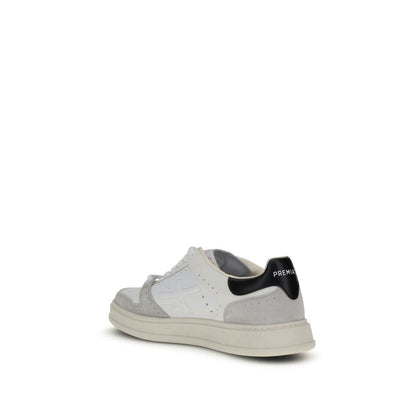 Premiata White Calf Leather Bos Taurus Low Top Sneakers with logo embossed heel and perforated toe design.