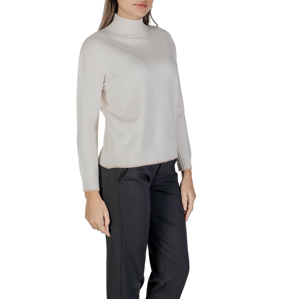 Woman wearing Street One Cream Polyester Sweatshirt with high neckline and ribbed hem, showcasing comfort and style.