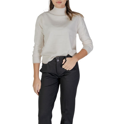 Woman wearing Street One Cream Polyester Sweatshirt with high neckline and ribbed hem for cozy, stylish look.