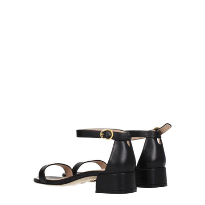 Stuart Weitzman Black Leather Flat Sandals with buckle closure and mid heels, open toe design.