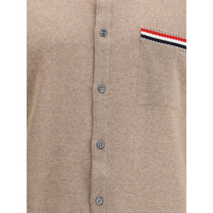 Thom Browne Beige Fleece Wool Cardigan with button closure, ribbed collar, and tricolor detail on pocket.
